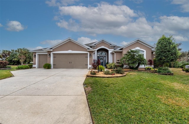 single story home featuring a garage and a front lawn