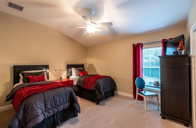 carpeted bedroom with lofted ceiling and ceiling fan