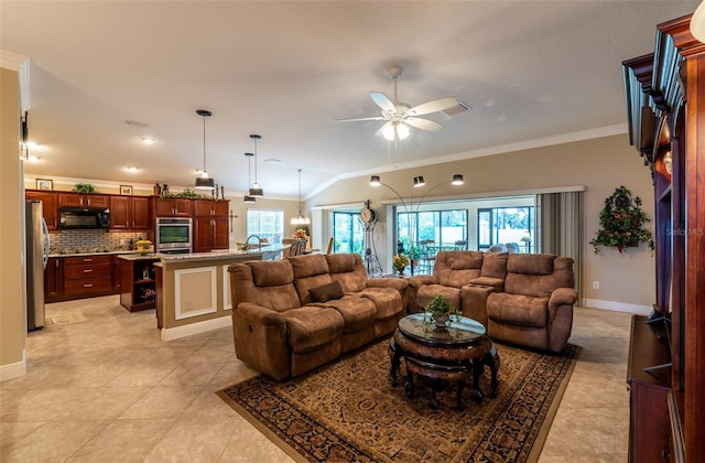 tiled living room featuring crown molding, lofted ceiling, sink, and ceiling fan