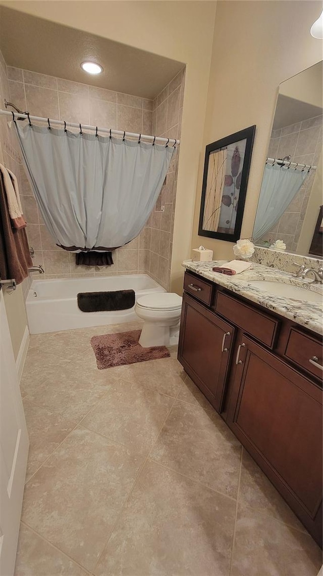 full bathroom with vanity, shower / bath combination with curtain, and toilet