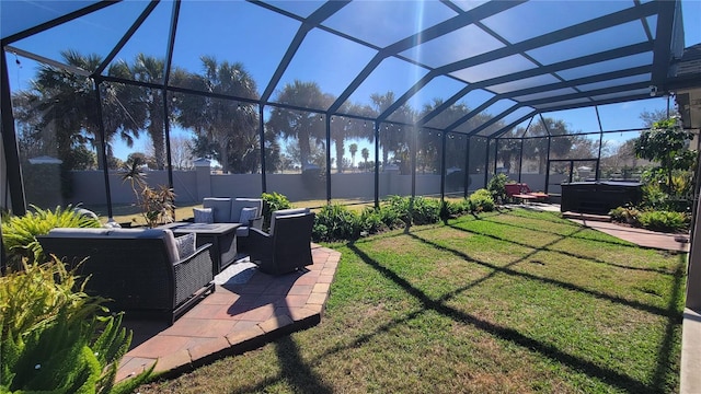 view of yard featuring a lanai, an outdoor hangout area, a patio area, and a hot tub