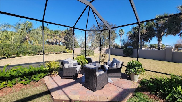 view of patio / terrace with an outdoor living space and glass enclosure