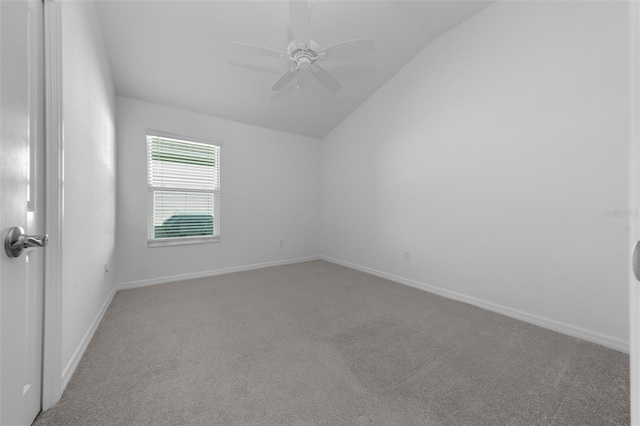 unfurnished room featuring vaulted ceiling, ceiling fan, and carpet