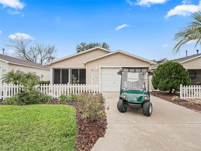 ranch-style home with a garage and a front lawn