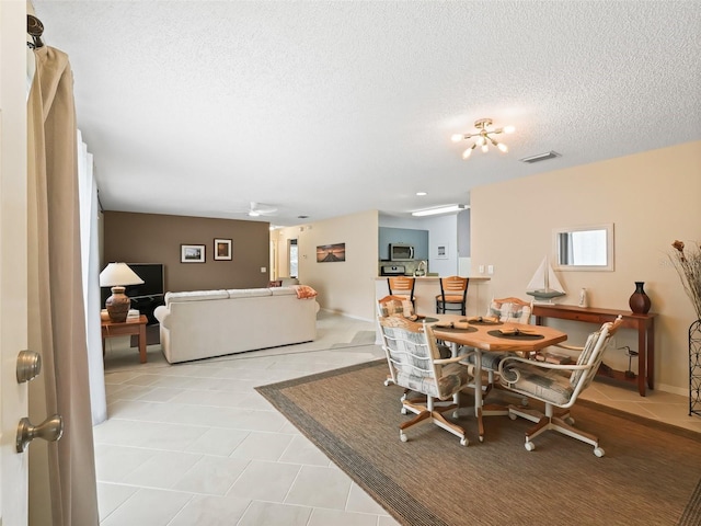 dining room with a textured ceiling