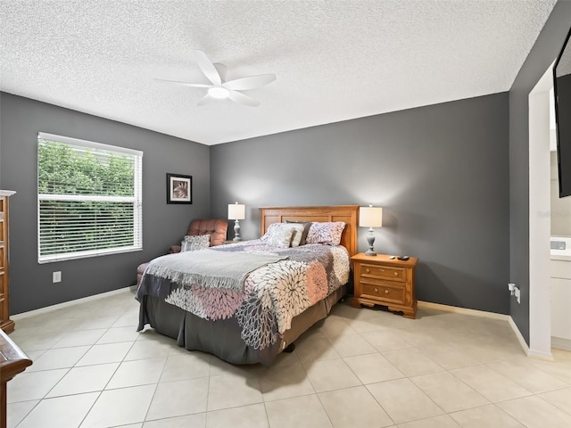 tiled bedroom featuring ceiling fan and a textured ceiling