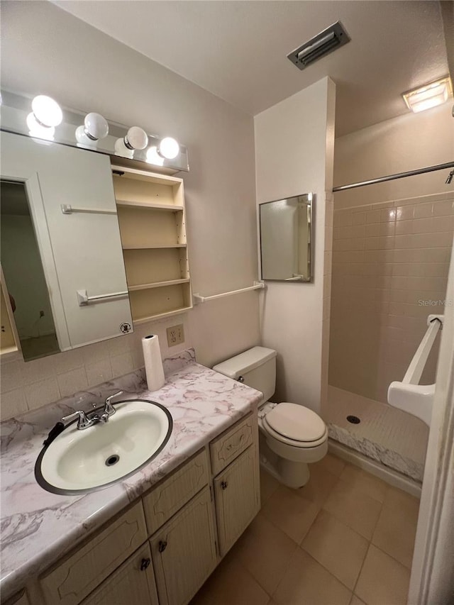 full bathroom with visible vents, a shower stall, toilet, tile patterned floors, and vanity
