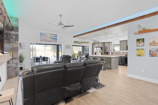 living room featuring ceiling fan and light hardwood / wood-style floors