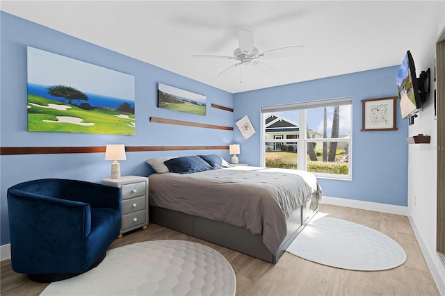 bedroom featuring ceiling fan and light hardwood / wood-style floors