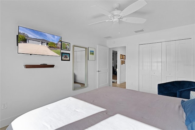 bedroom featuring ceiling fan and a closet