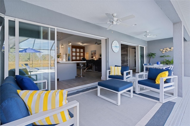 view of patio / terrace featuring an outdoor living space and ceiling fan