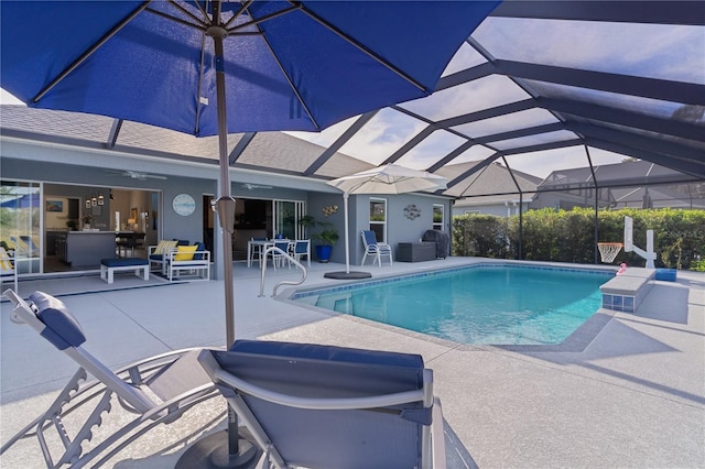 view of pool featuring a lanai and a patio