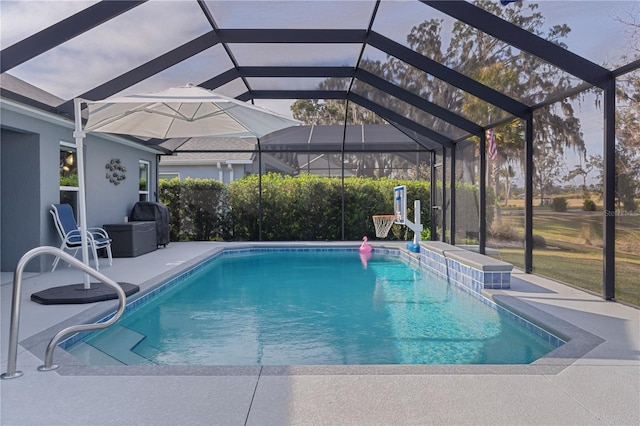 view of pool with a patio, a lanai, and grilling area