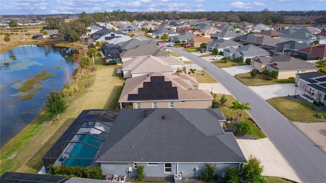 aerial view with a water view and a residential view