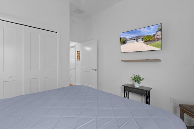 unfurnished bedroom with a closet and visible vents