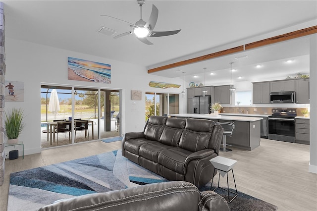 living room with visible vents, ceiling fan, beamed ceiling, light wood-type flooring, and recessed lighting