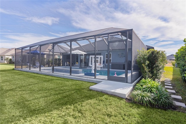 back of house featuring a lanai, an outdoor pool, a lawn, and a patio