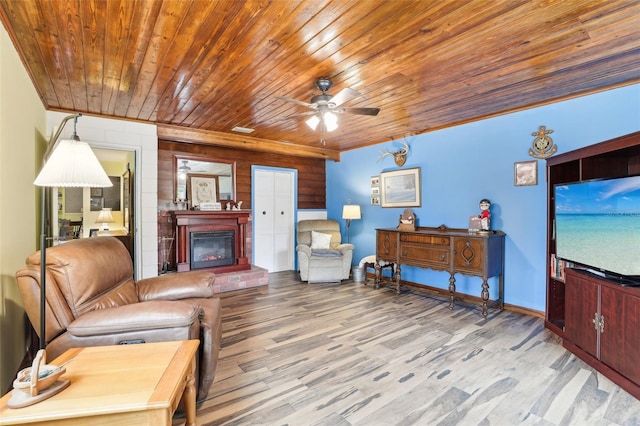 living room featuring ceiling fan and hardwood / wood-style floors