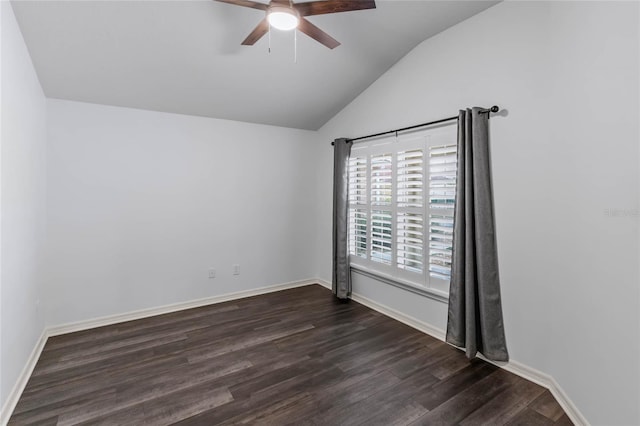 spare room with vaulted ceiling, ceiling fan, and dark hardwood / wood-style floors