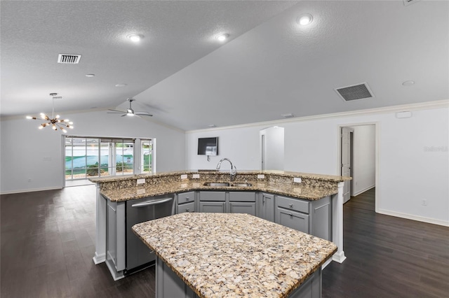 583 Arruda Ter, The Villages, FL 32162 - kitchen featuring dishwasher, a kitchen island with sink, a sink, open floor plan, and gray cabinets
