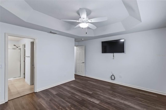 583 Arruda Ter, The Villages, FL 32162 - unfurnished living room with a raised ceiling, a ceiling fan, wood finished floors, and baseboards