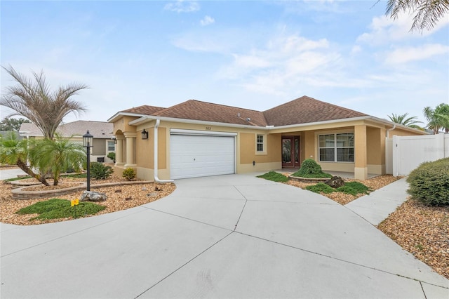 583 Arruda Ter, The Villages, FL 32162 - ranch-style home with stucco siding, a garage, and concrete driveway