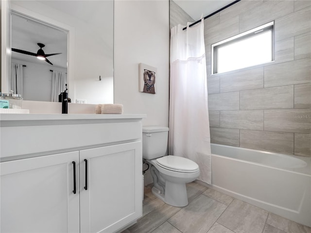 full bathroom featuring vanity, shower / bathtub combination with curtain, and toilet