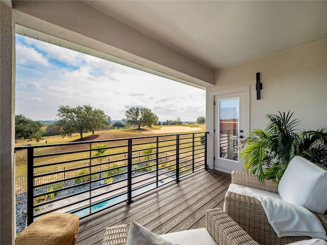 balcony featuring a rural view