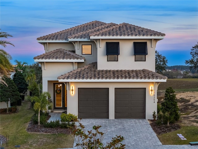 mediterranean / spanish-style house featuring a garage