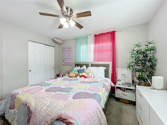 carpeted bedroom featuring a closet and ceiling fan