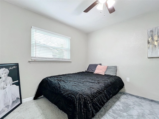 bedroom featuring light carpet and ceiling fan