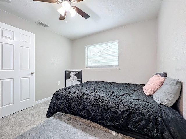 bedroom with light colored carpet and ceiling fan