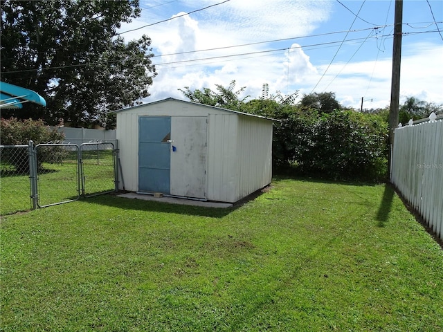 view of outbuilding featuring a lawn