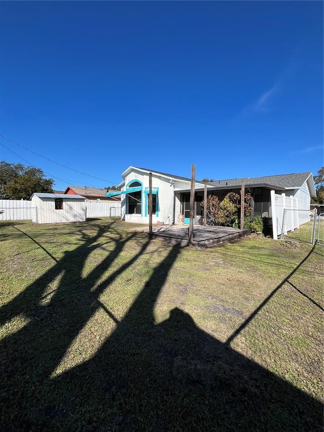 rear view of house with a yard and a patio area