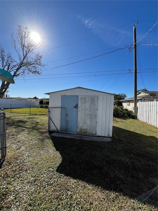 view of outdoor structure with a lawn