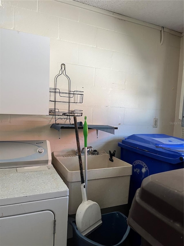 laundry room featuring washer / clothes dryer and sink