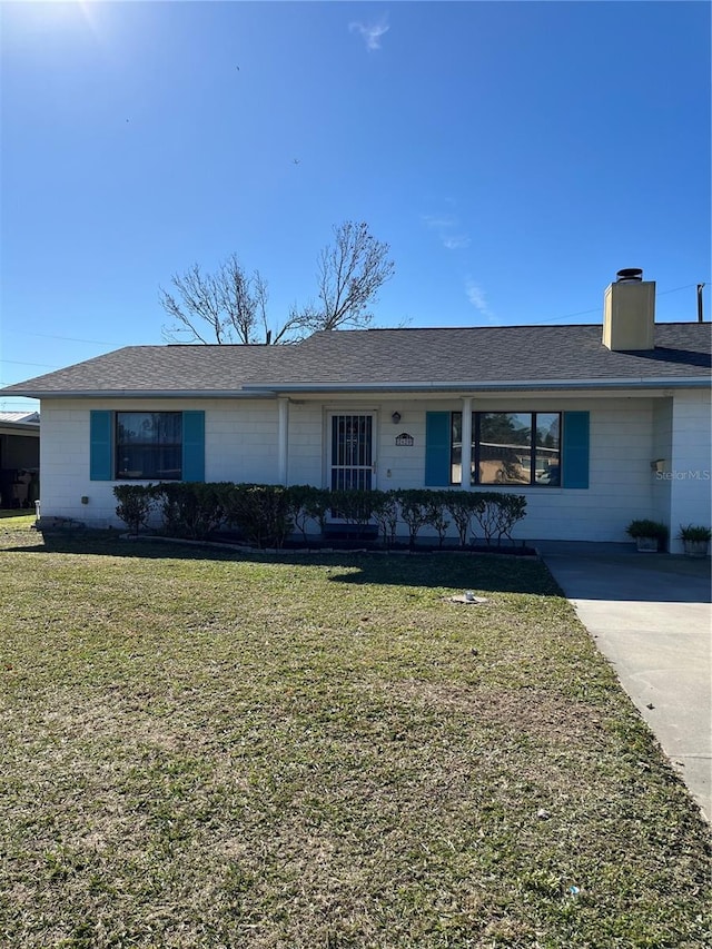 ranch-style house with a front lawn