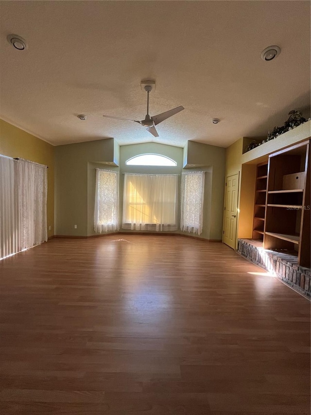 empty room with wood-type flooring and ceiling fan