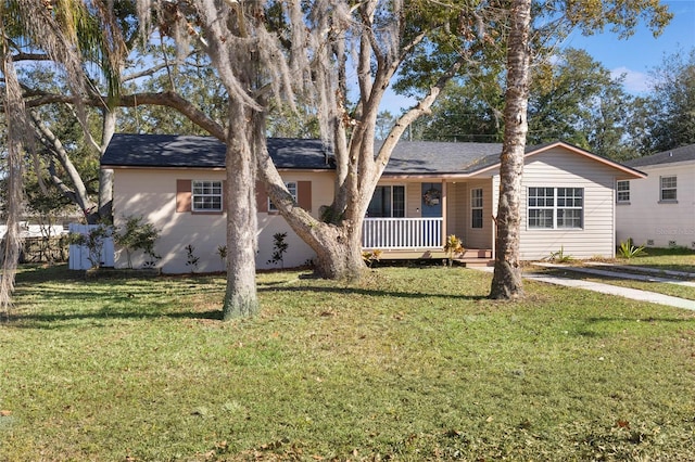 single story home featuring a front lawn and a porch