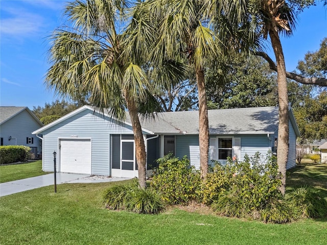 single story home with a garage and a front lawn