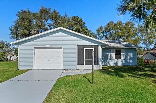 ranch-style home with a garage and a front lawn