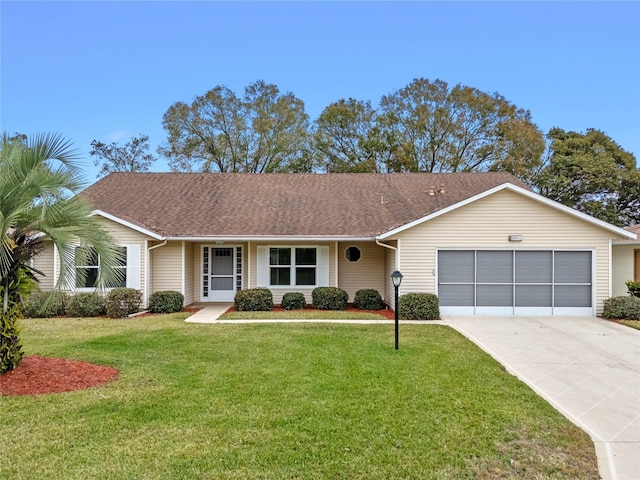 single story home with a garage and a front yard