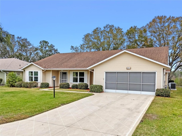 ranch-style home featuring a garage and a front lawn