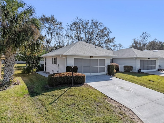 view of front of home with a garage and a front yard