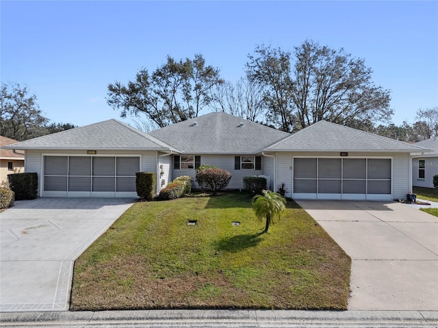 single story home featuring a garage and a front yard