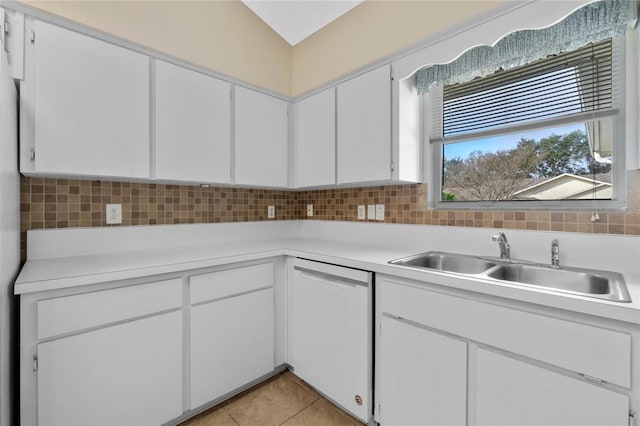 kitchen with sink, white cabinetry, white dishwasher, tasteful backsplash, and light tile patterned flooring