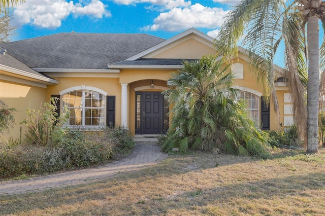 entrance to property with a yard