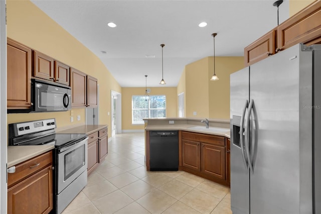 kitchen with pendant lighting, sink, light tile patterned floors, lofted ceiling, and black appliances