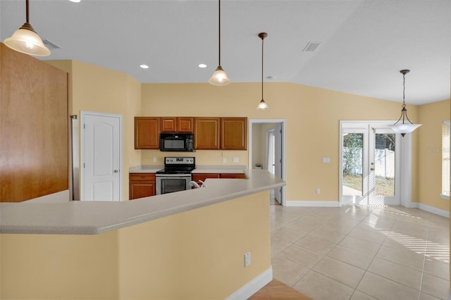 kitchen with hanging light fixtures, light tile patterned floors, and stainless steel range with electric cooktop