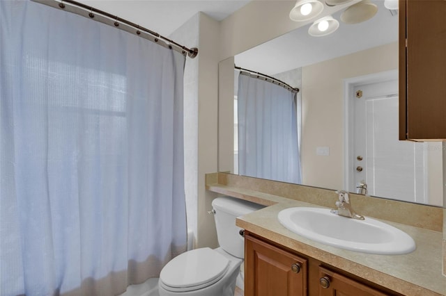 full bathroom with vanity, toilet, and shower / bath combo with shower curtain